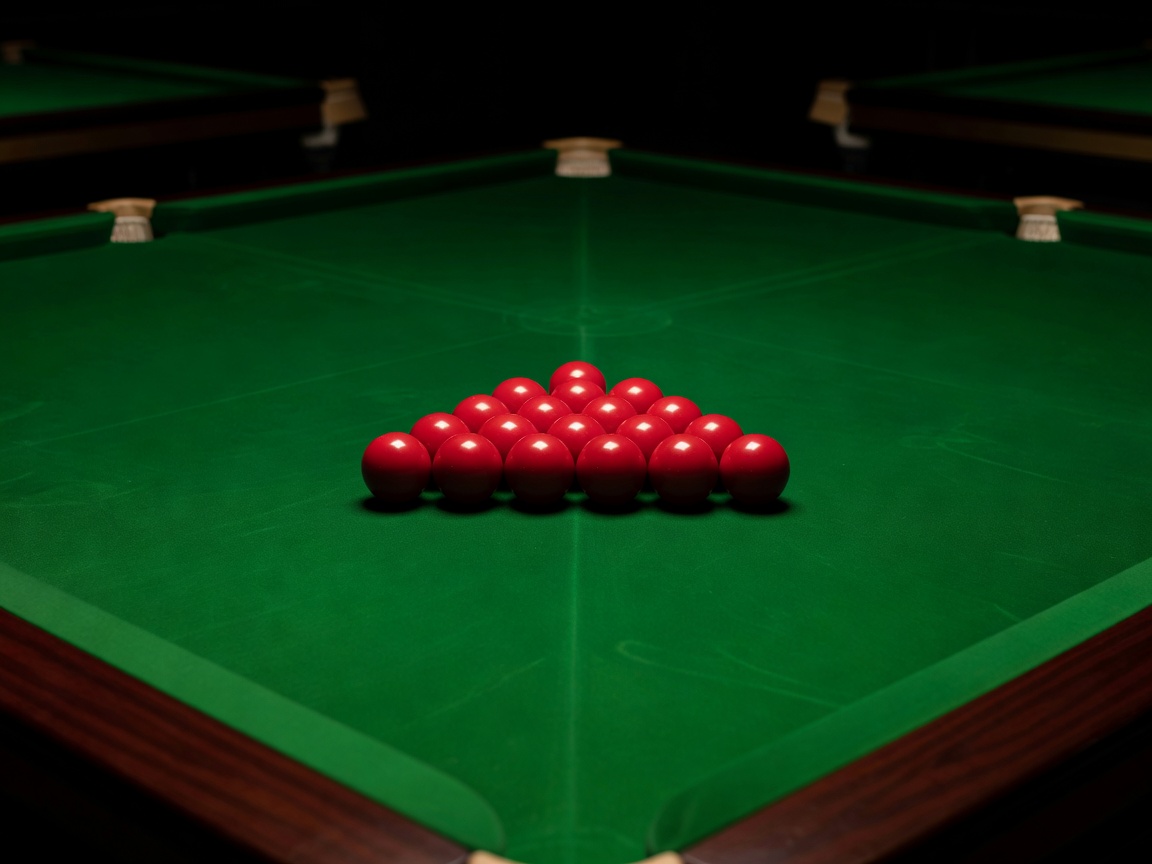 Red snooker balls racked on a large table